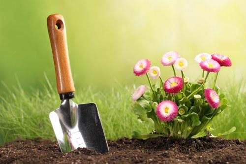 Gardener inspecting plants with clipboard